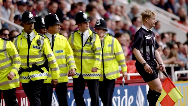 1 May 1999:  Police move into protect assistant referee Paul Norman from hostile fans during the FA Carling Premiership match between West Ham United v Lee