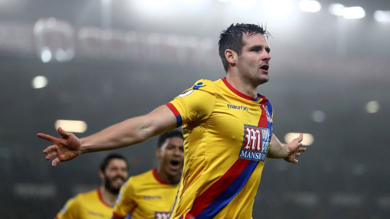 Scott Dann celebrates scoring the opening goal of the game
