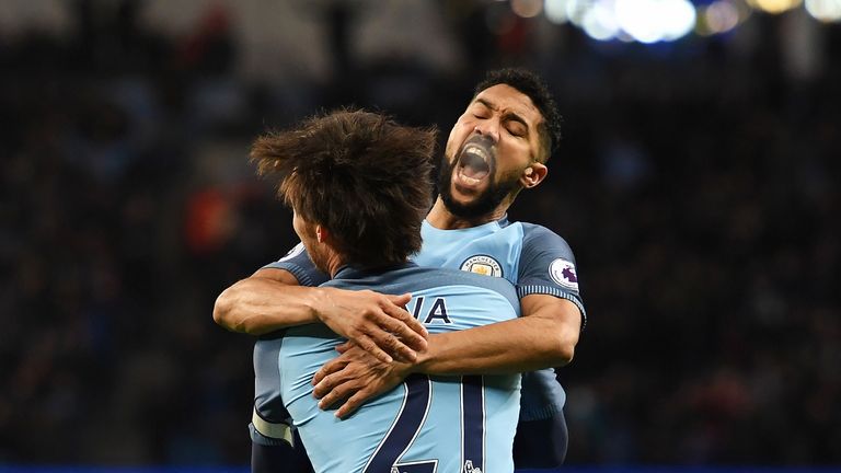 Gael Clichy celebrates the game's opening goal with David Silva
