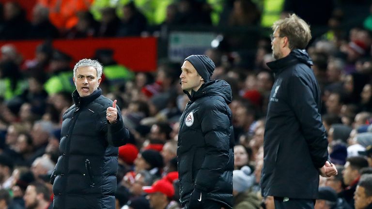 Jose Mourinho and Jurgen Klopp exchange views on the touchline at Old Trafford