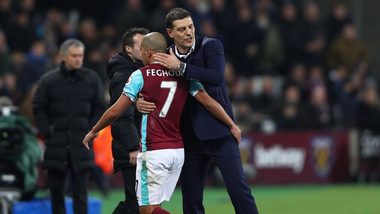 Slaven Bilic embraces Sofiane Feghouli following his red card for a challenge on Phil Jones