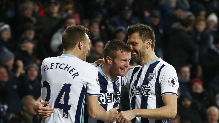 Chris Brunt celebrates with team-mates after levelling the score at The Hawthorns