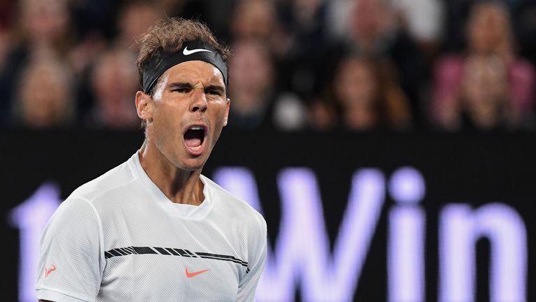 Rafael Nadal reacts after a point against Milos Raonic in their quarter-final match