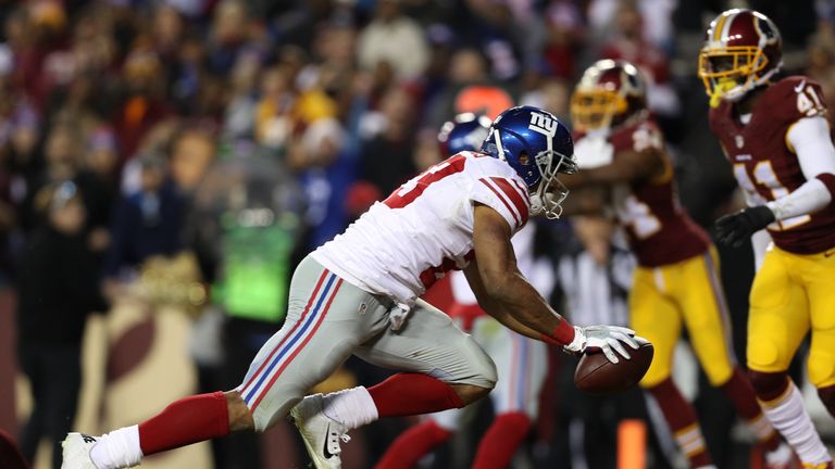 LANDOVER, MD - JANUARY 01: Running back Rashad Jennings #23 of the New York Giants scores a second quarter touchdown against free safety Will Blackmon #41 