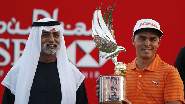 Rickie Fowler of the United States celebrates with his trophy after winning in the final of the Abu Dhabi Golf Championship in the capital of the United Ar