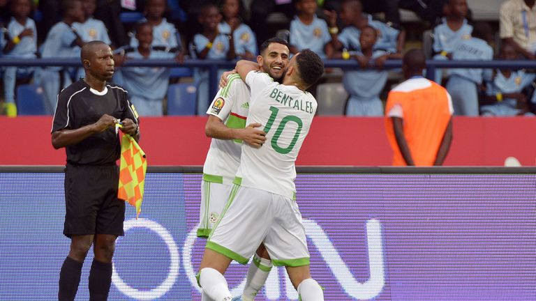 Algeria's forward Riyad Mahrez (back) celebrates with Algeria's midfielder Nabil Bentaleb after scoring a goal during the 2017 Africa Cup of Nations group 