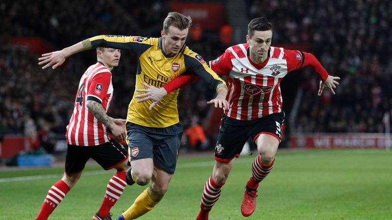 Arsenal's Rob Holding (C) vies with Southampton's Florin Gardos (R) during the FA Cup fourth round