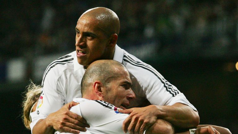 Roberto Carlos and Zinedine Zidane celebrate together at Real Madrid