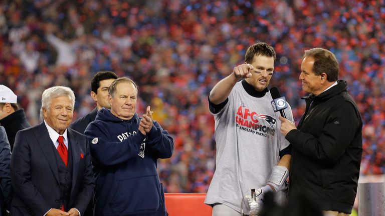 FOXBORO, MA - JANUARY 22:  Jim Nantz (R) interviews Tom Brady #12 of the New England Patriots as team owner Robert Kraft (L) and head coach Bill Belichick 