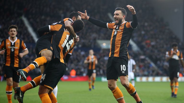 Robert Snodgrass of Hull City (R) celebrates scoring his sides first goal with his Hull City team mates