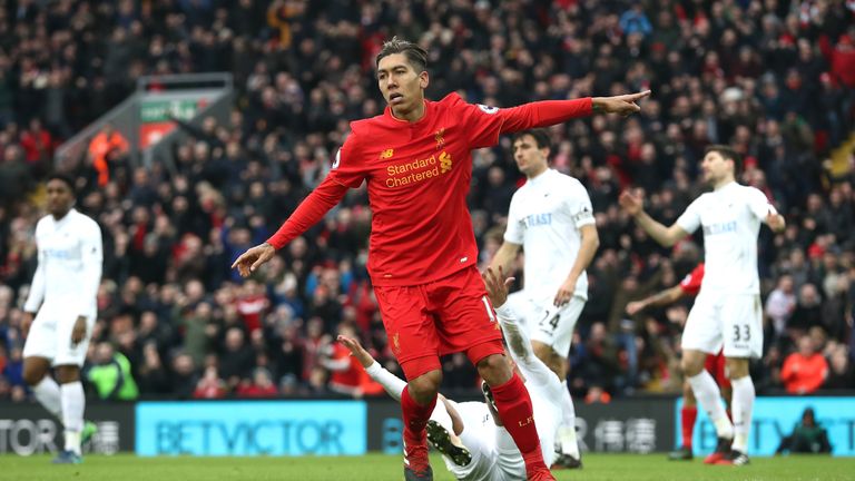 LIVERPOOL, ENGLAND - JANUARY 21: Roberto Firmino of Liverpool celebrates scoring his sides first goal during the Premier League match between Liverpool and