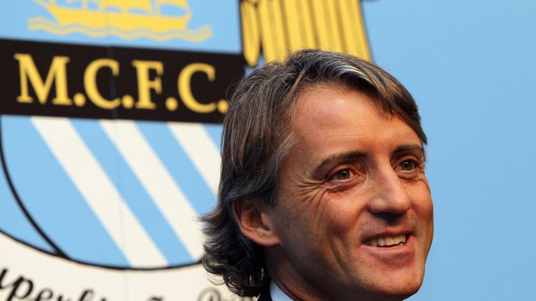 MANCHESTER, ENGLAND - DECEMBER 21:  Roberto Mancini the new manager of Manchester City faces the media during a press conference held at the City of Manche