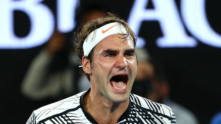 Roger Federer celebrates winning championship point in the 2017 Australian Open men's singles final