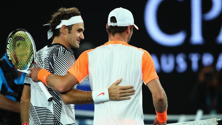 MELBOURNE, AUSTRALIA - JANUARY 24:  Roger Federer of Switzerland shakes hands at the net after victory in his quarterfinal match against Mischa Zverev of G