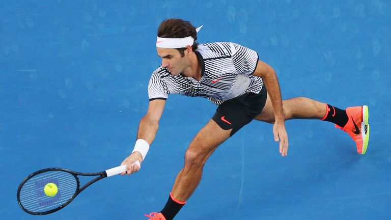 MELBOURNE, AUSTRALIA - JANUARY 24:  Roger Federer of Switzerland plays a forehand volley in his quarterfinal match against Mischa Zverev of Germany day nin