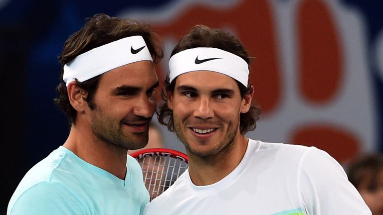 Spain's Rafael Nadal of the Indian Aces (R) and Switzerland's Roger Federer of the Japan Warriors greet each other during practice at the International Pre