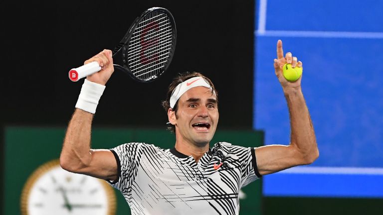 Switzerland's Roger Federer celebrates his victory against Spain's Rafael Nadal during the men's singles final on day 14 of the Australian Open tennis tour