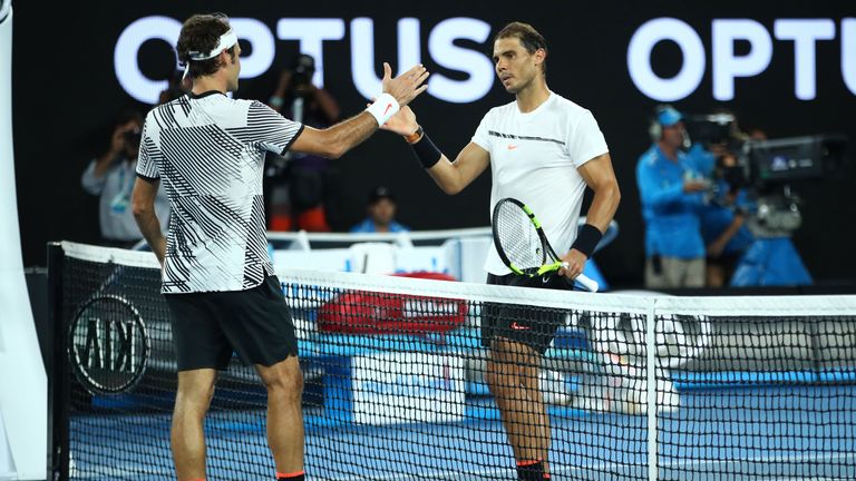 MELBOURNE, AUSTRALIA - JANUARY 29:  Roger Federer of Switzerland is congratulated by Rafael Nadal of Spain after winning their Men's Final match against  o