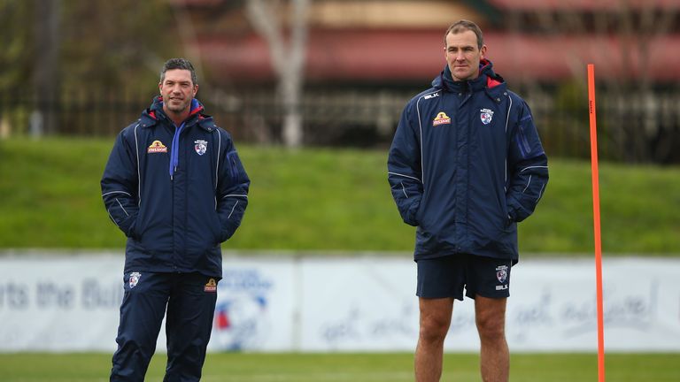 Assistant coaches Rohan Smith and Steven King look on during a Western Bulldogs training session at Whitten Oval