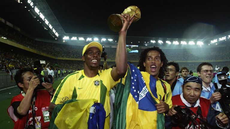 YOKOHAMA - JUNE 30:  Roque Junior (left) and Ronaldinho of Brazil lift the trophy after the Germany v Brazil, World Cup Final match played at the Internati