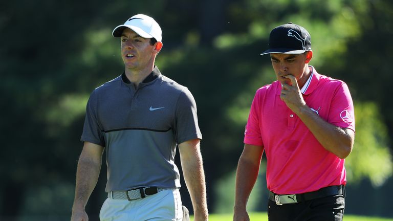 SPRINGFIELD, NJ - JULY 27: (L-R) Rory McIlroy of Northern Ireland and Rickie Fowler of the United States walk the 14th hole during a practice round prior t