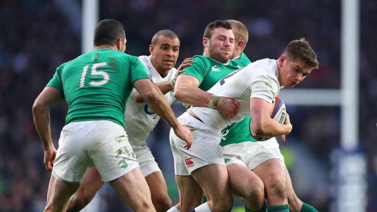 Owen Farrell is tackled by Robbie Henshaw of Ireland during the 2016 Six Nations