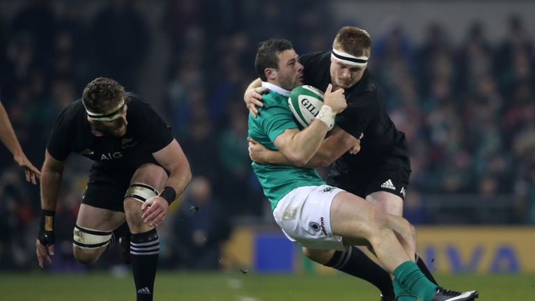 Ireland centre Robbie Henshaw is knocked unconscious after a tackle by Sam Cane