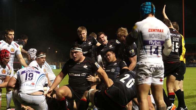 Saracens players celebrate Titi Lamositele's try against Exeter