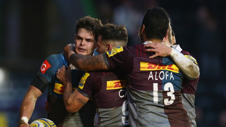Tim Swiel of Harlequins celebrates scoring a try