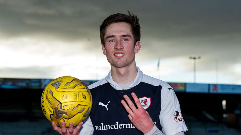 Raith's Ryan Hardie celebrates his hat-trick with the match ball at full time against St Mirren