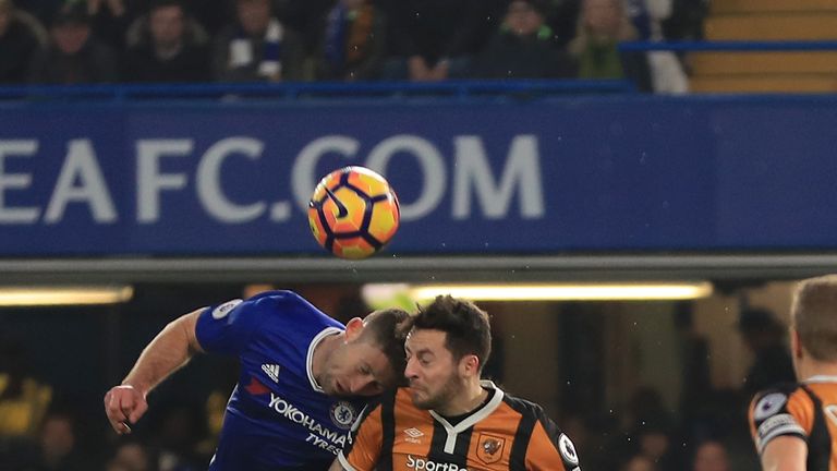 Gary Cahill and Ryan Mason collide at Stamford Bridge on Sunday