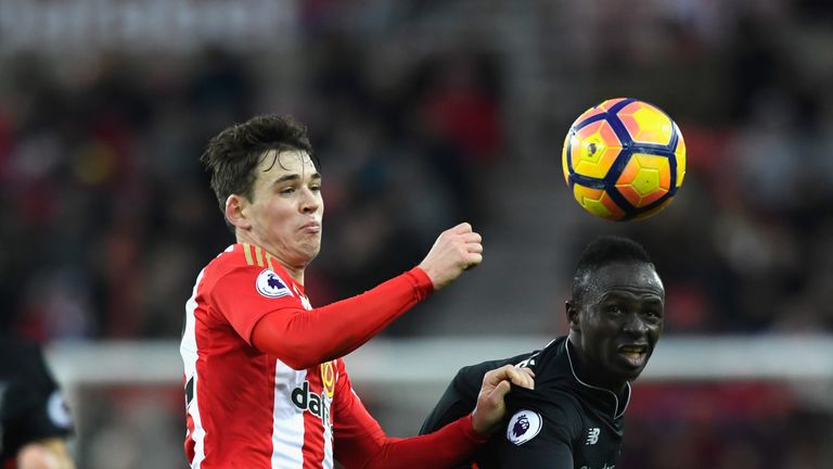 SUNDERLAND, ENGLAND - JANUARY 02:  Sunderland player Donald Love (l) is challenged by Sadio Mane of Liverpool during the Premier League match between Sunde