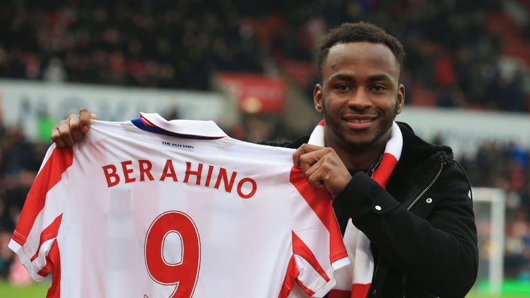 Stoke City's new English striker Saido Berahino poses with his jersey ahead of the English Premier League football match between Stoke City and Manchester 