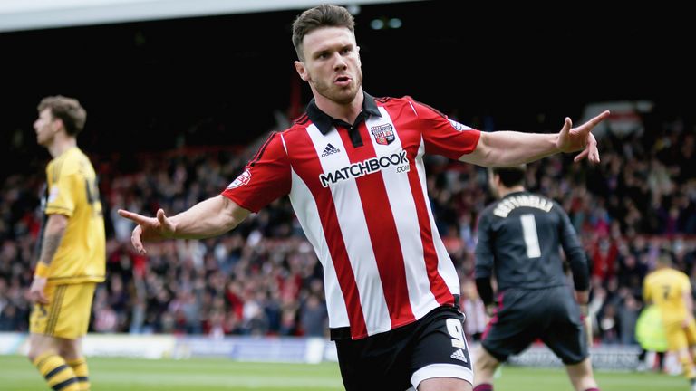 Scott Hogan celebrates during the Sky Bet Championship match against Fulham at Griffin Park