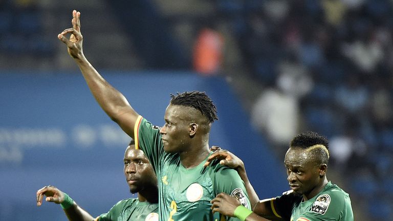 Senegal's defender Kara Mbodji (C) celebrates with Senegal's midfielder Idrissa Gana Gueye (L) and Senegal's forward Sadio Mane (R) after scoring a goal du
