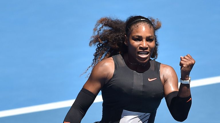 Serena Williams of the US celebrates her win against Czech Republic's Barbora Strycova during their women's singles fourth round match on day eight of the 