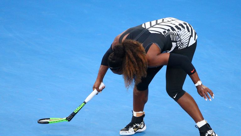 MELBOURNE, AUSTRALIA - JANUARY 28:  Serena Williams of the United States slips and breaks her racquet in her Women's Singles Final match against Venus Will