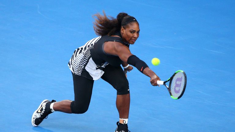 MELBOURNE, AUSTRALIA - JANUARY 28:  Serena Williams of the United States plays a backhand in her Women's Singles Final match against Venus Williams of the 