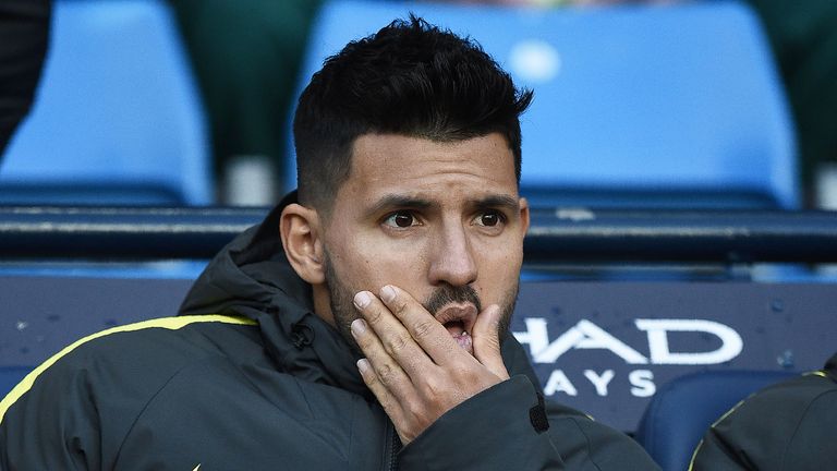 Sergio Aguero watches the action from the Manchester City bench