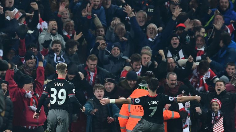 Shane Long (R) celebrates scoring Southampton's first goal during the EFL Cup semi-final second-leg tie at Liverpool