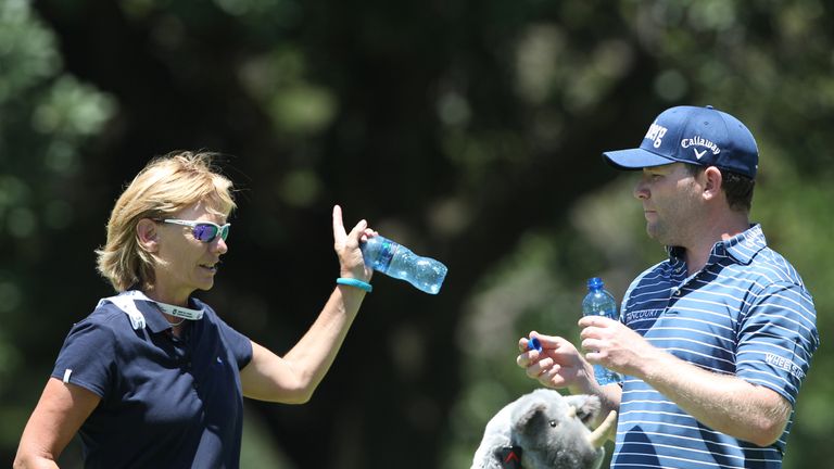 JOHANNESBURG, SOUTH AFRICA - JANUARY 06: Branden Grace of South Africa chats to his eye coach Dr Sherylle Calder while playing a practice round before the 