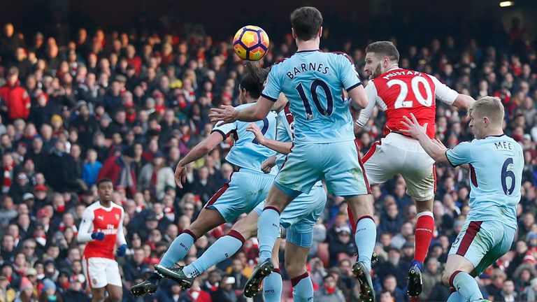 Arsenal's German defender Shkodran Mustafi (2nd R) climbs to head the opening goal of the English Premier League football match between Arsenal and Burnley