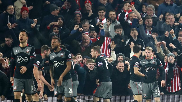 LIVERPOOL, ENGLAND - JANUARY 25: Shane Long of Southampton (not pictured) celebrates with team mates after scoring his sides first goal during the EFL Cup 