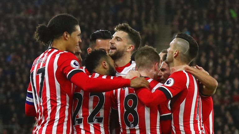 Nathan Redmond of Southampton (22) celebrates with team-mates as he scores their first goal during the EFL Cup semi-final v Liverpool