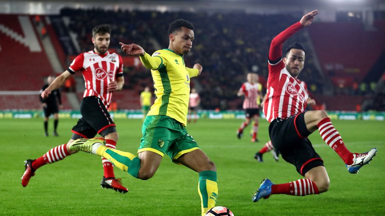 SOUTHAMPTON, ENGLAND - JANUARY 18:  Josh Murphy of Norwich City is challenged by Maya Yoshida of Southampton during The Emirates FA Cup Third Round Replay 