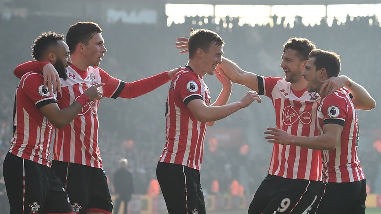 Southampton's English midfielder James Ward-Prowse (C) celebrates with teammates after scoring the opening goal of the English Premier League football matc