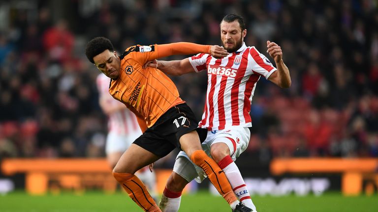 Hélder Costa of Wolces and Erik Peters of Stoke in action during the FA Cup third round clash