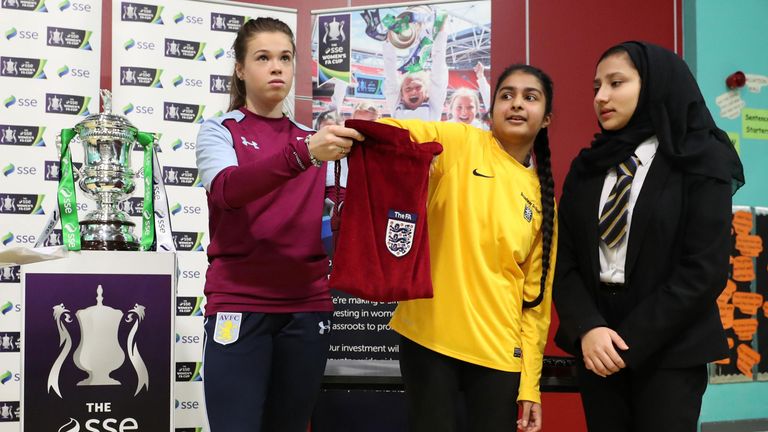 Broadway Academy students assist Aston Villa skipper Beth Merrick with draw