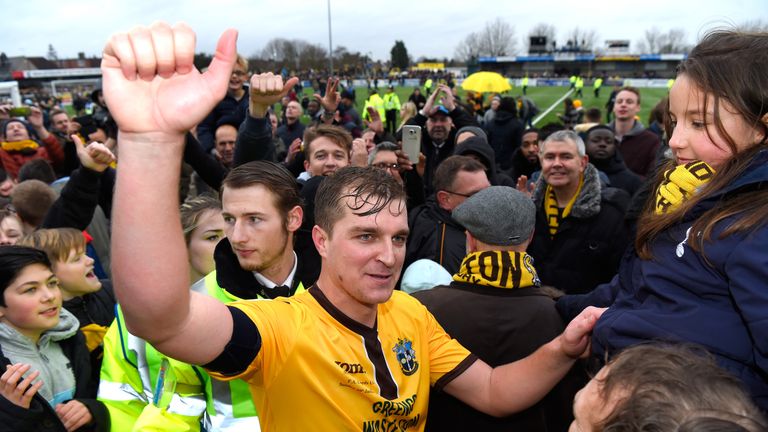 Jamie Collins is mobbed by Sutton United fans after the FA Cup win over Leeds