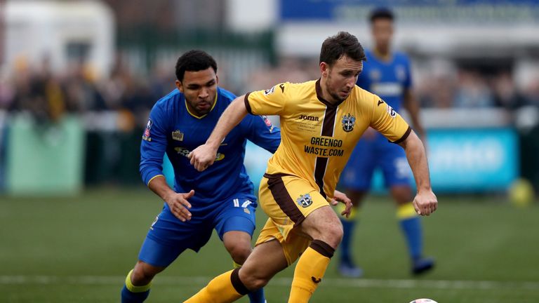 Andy Barcham of AFC Wimbledon closes down Sutton United's Matt Tubbs during the FA Cup third round clash